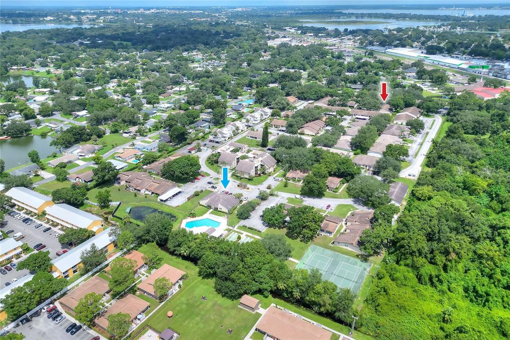 2025 Sylvester Road, Unit E1 Lakeland, FL 33803 - Photo 37 of 37 an aerial view of residential houses with outdoor space and trees
