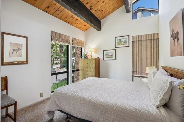 a bedroom with a bed and a table in it