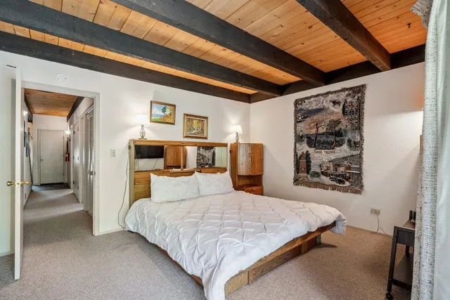 a bedroom with a bed and a walk in closet