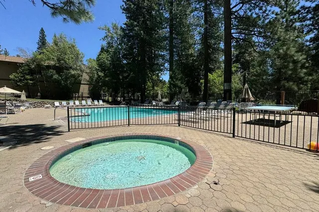 a view of a swimming pool with a porch