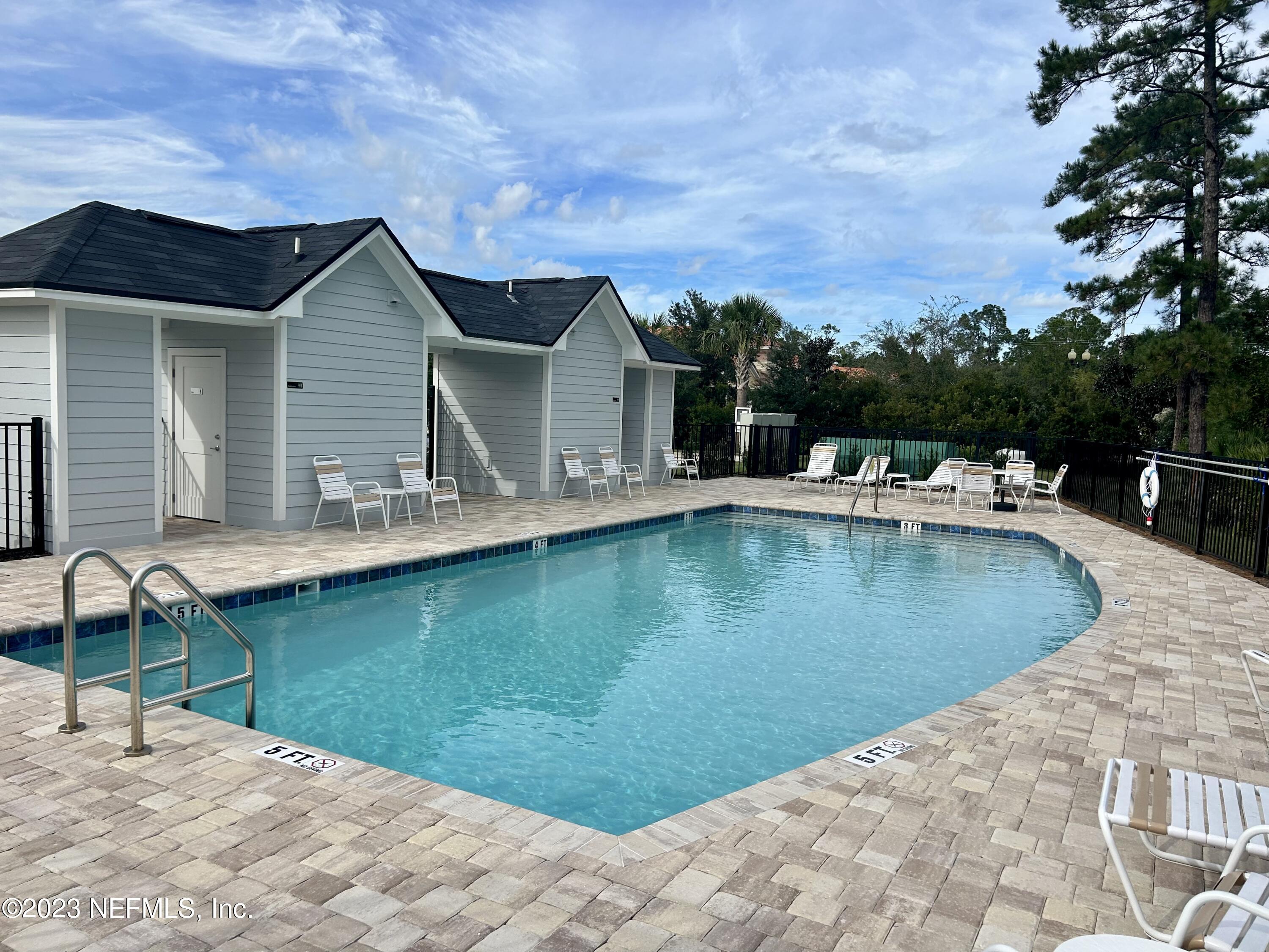 25 Ridge Lake Road St. Augustine, FL 32086 - Photo 24 of 27 a view of a house with swimming pool and sitting area