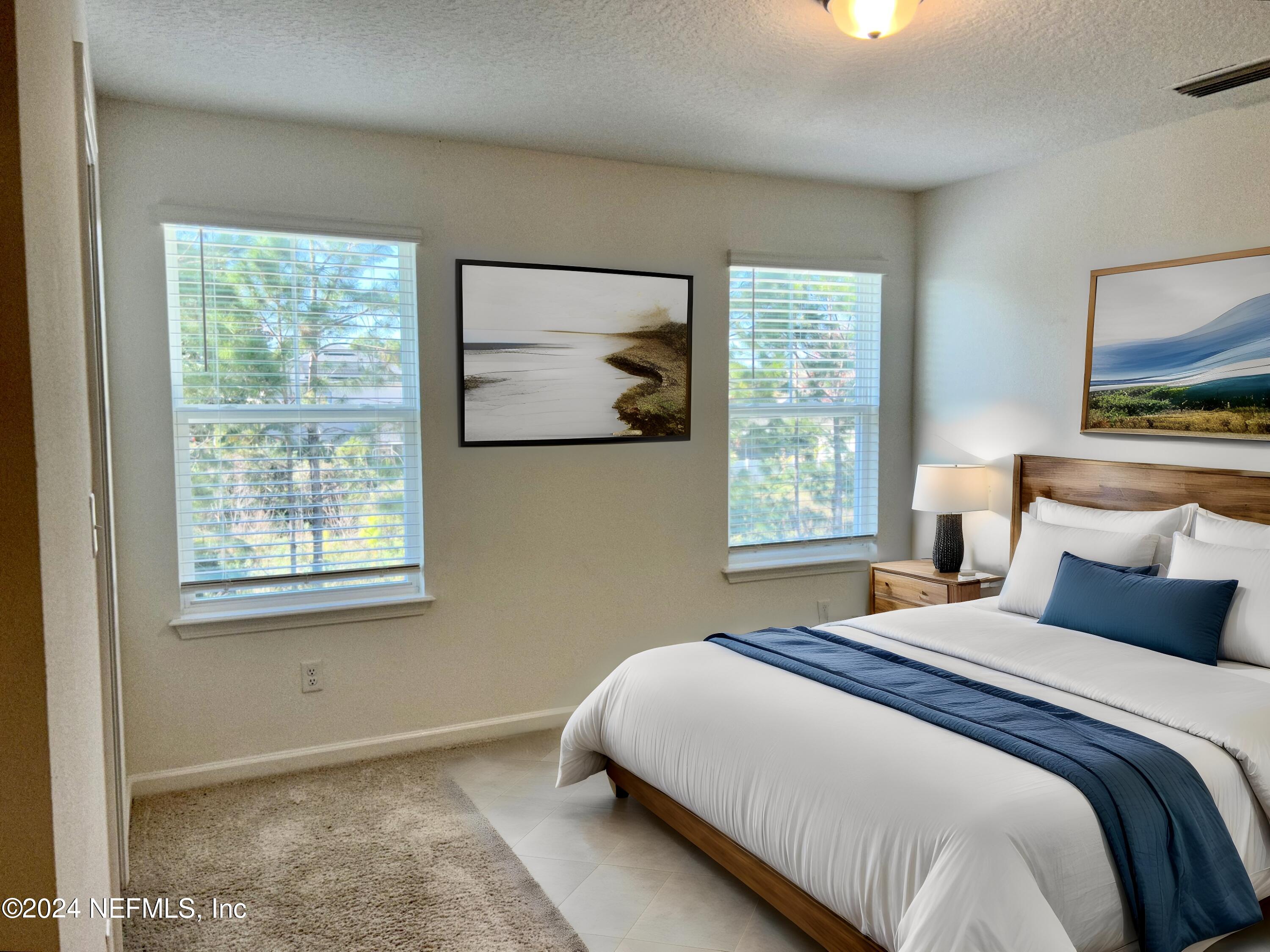 25 Ridge Lake Road St. Augustine, FL 32086 - Photo 3 of 27 a bedroom with a bed and a window