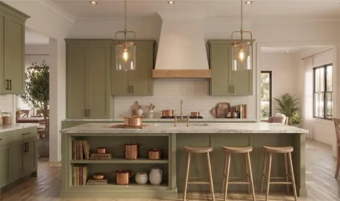 a kitchen with stainless steel appliances granite countertop a sink and a refrigerator
