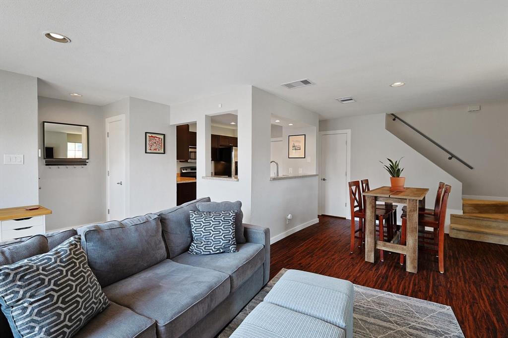 4777 Cedar Springs Road, Unit 8K Dallas, TX 75219 - Photo 1 of 1 a living room with furniture and wooden floor