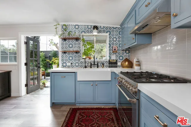 a kitchen with a stove and a sink