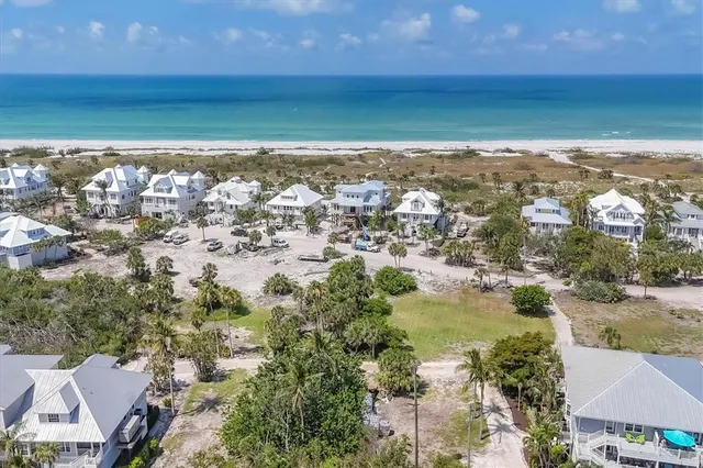an aerial view of residential building with ocean view