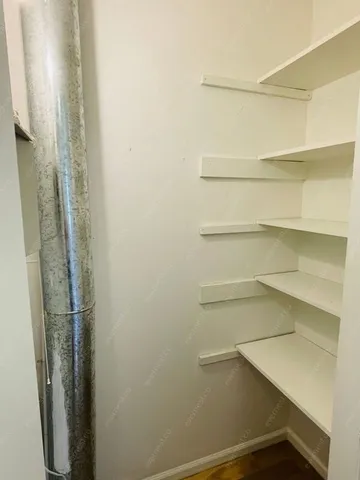 a view of small space with racks on the wall