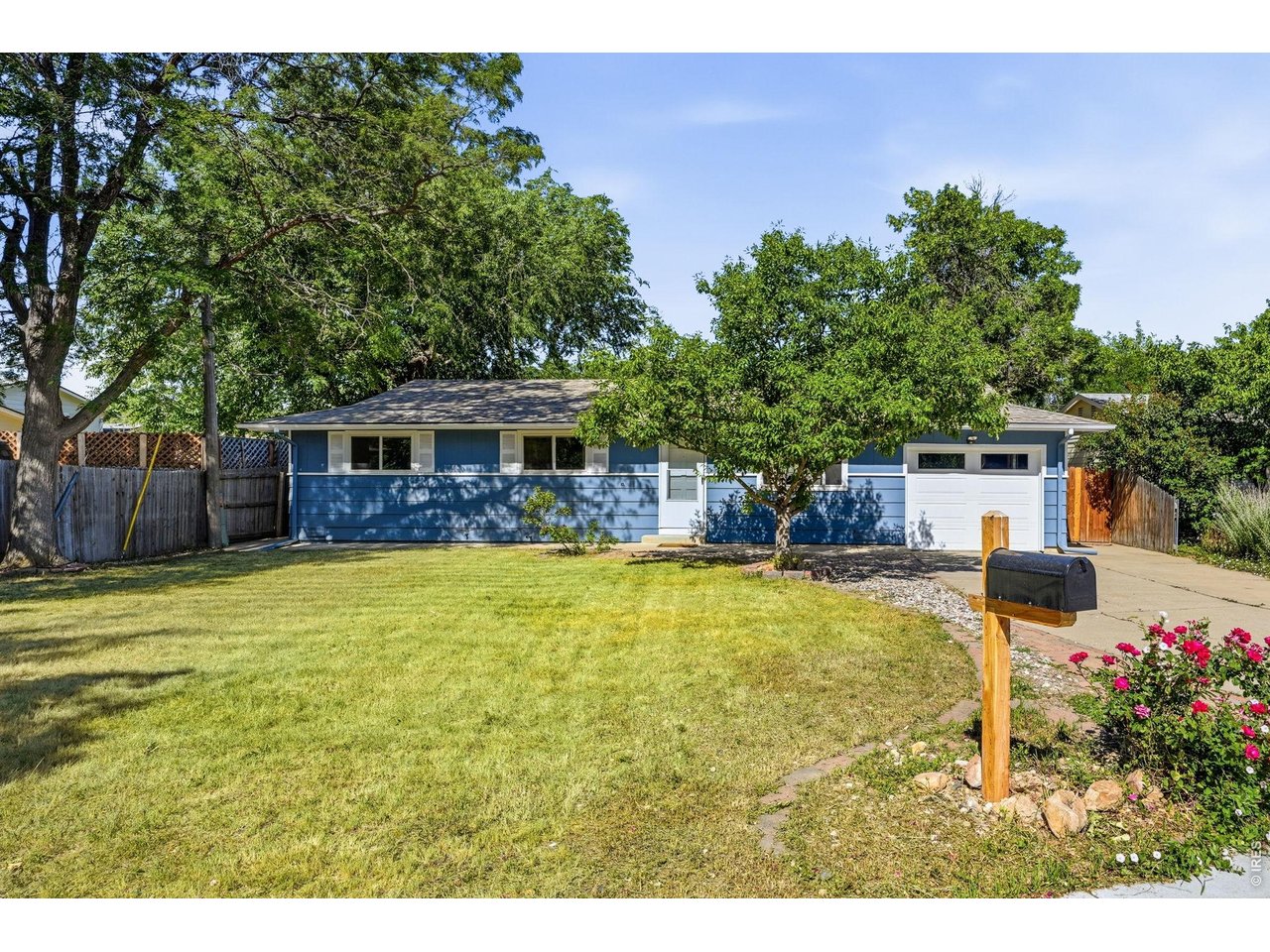 1035 6th Street Berthoud, CO 80513 - Photo 1 of 37 a swimming pool with outdoor seating and yard