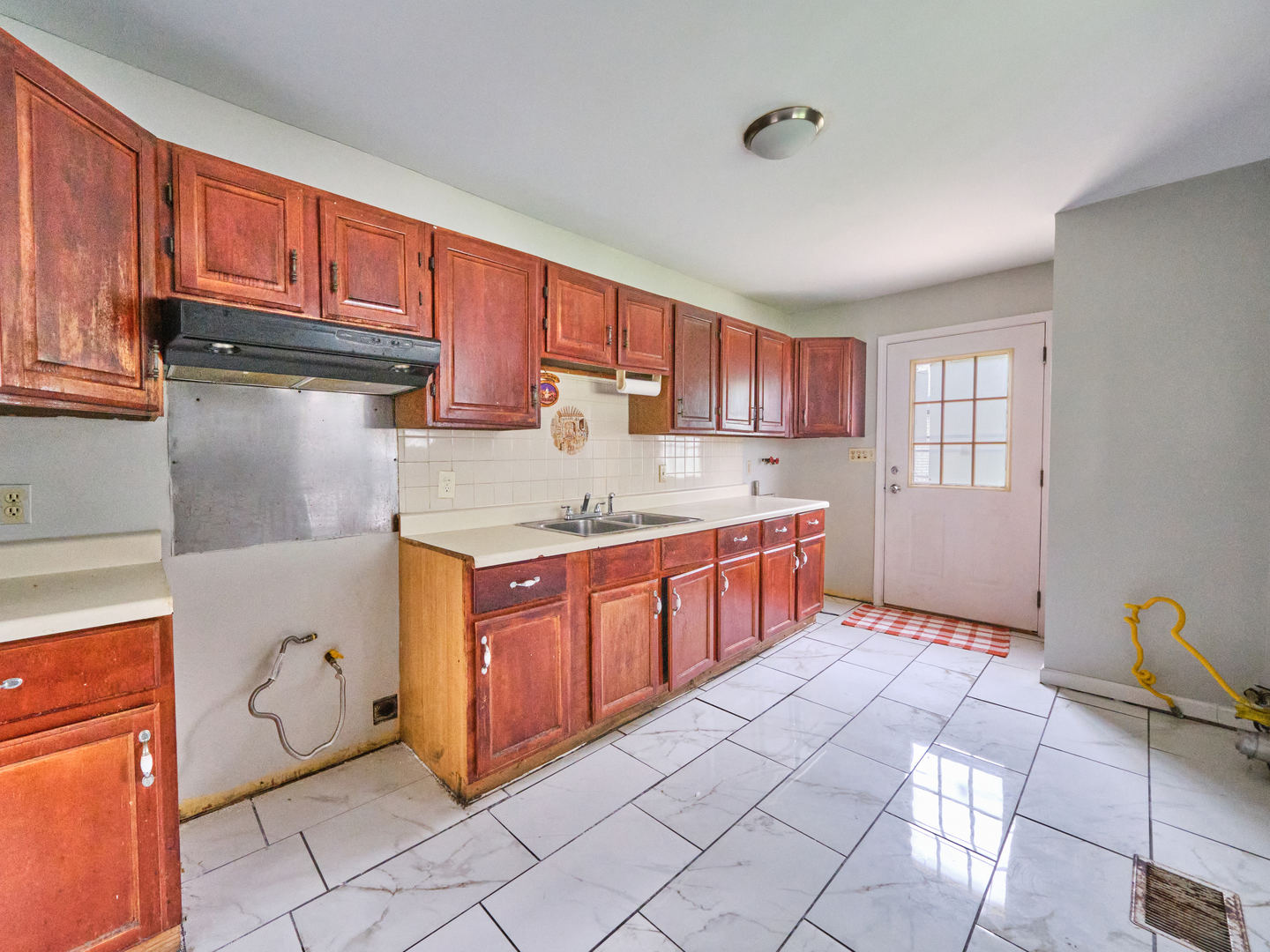 109 George Road Wheeling, IL 60090 - Photo 4 of 12 a kitchen with stainless steel appliances granite countertop a stove sink and cabinets