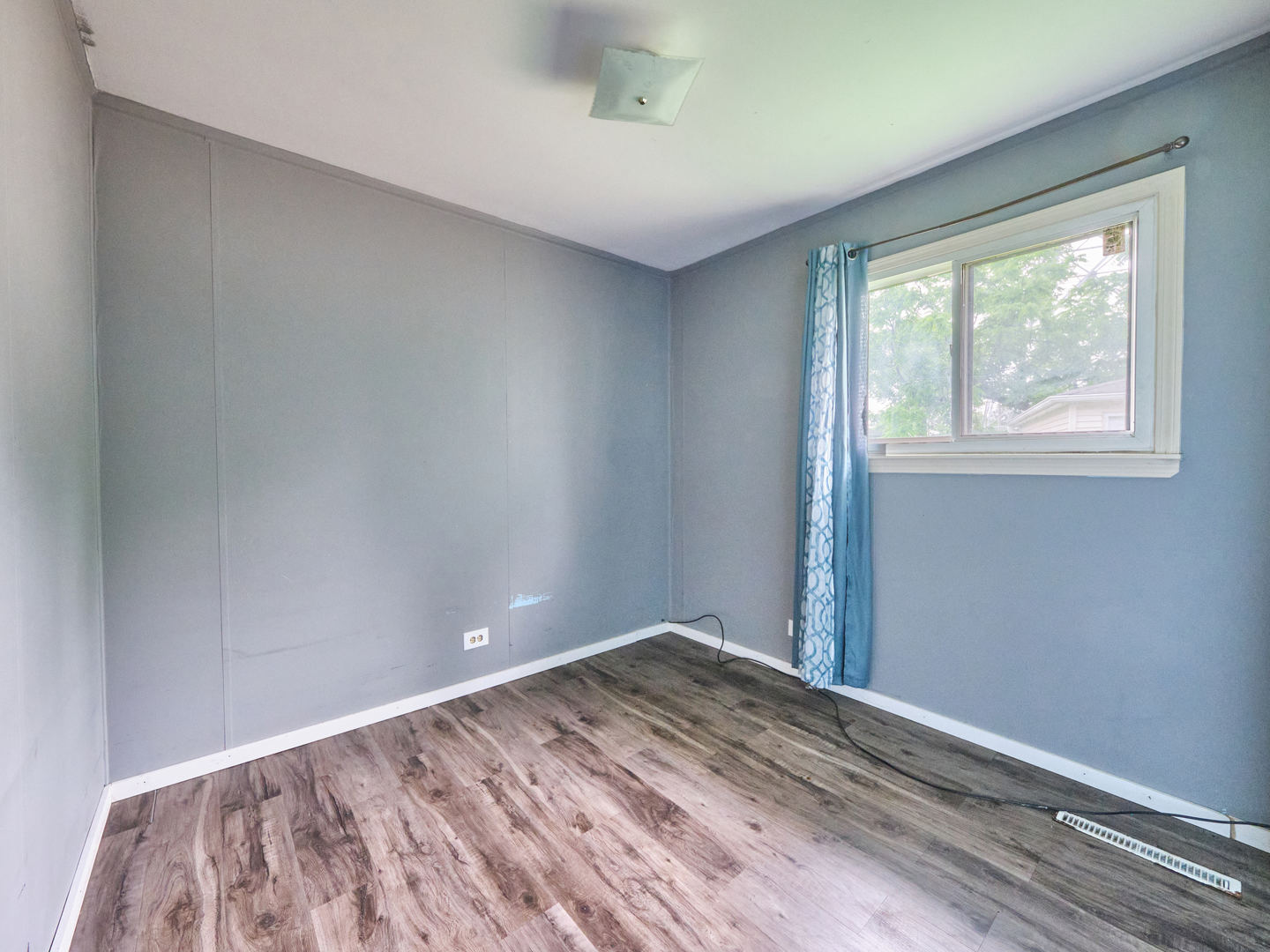 109 George Road Wheeling, IL 60090 - Photo 6 of 12 a view of room with window and hardwood floor