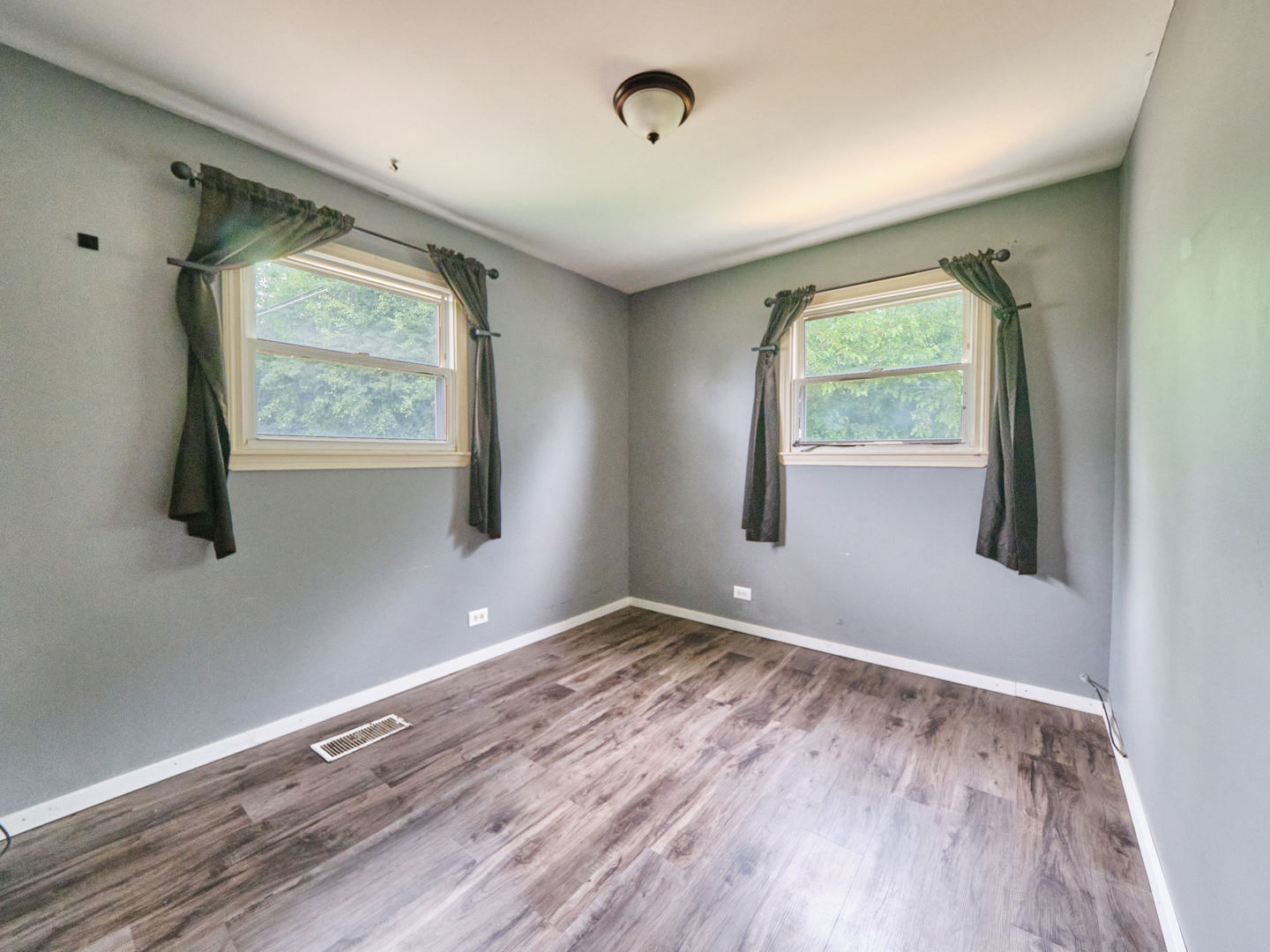 109 George Road Wheeling, IL 60090 - Photo 7 of 12 a view of room with window and wooden floor