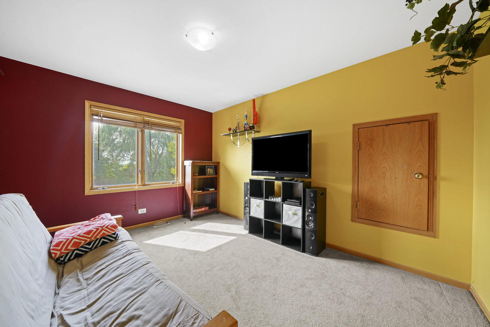 10808 Michigan Drive Spring Grove, IL 60081 - Photo 18 of 26 a bedroom with furniture and a flat screen tv