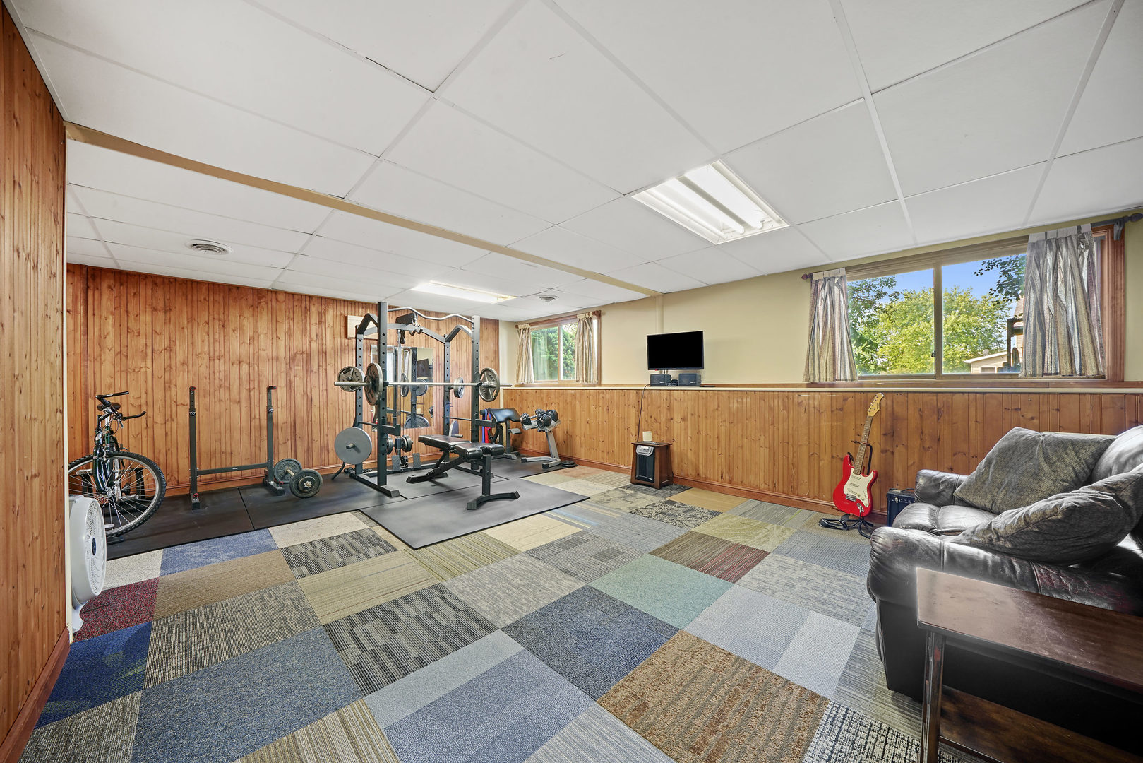 10808 Michigan Drive Spring Grove, IL 60081 - Photo 23 of 26 a living room with furniture a window and gym equipment