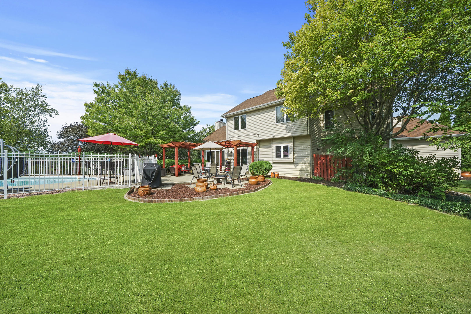 10808 Michigan Drive Spring Grove, IL 60081 - Photo 6 of 26 a view of a house with backyard and sitting area