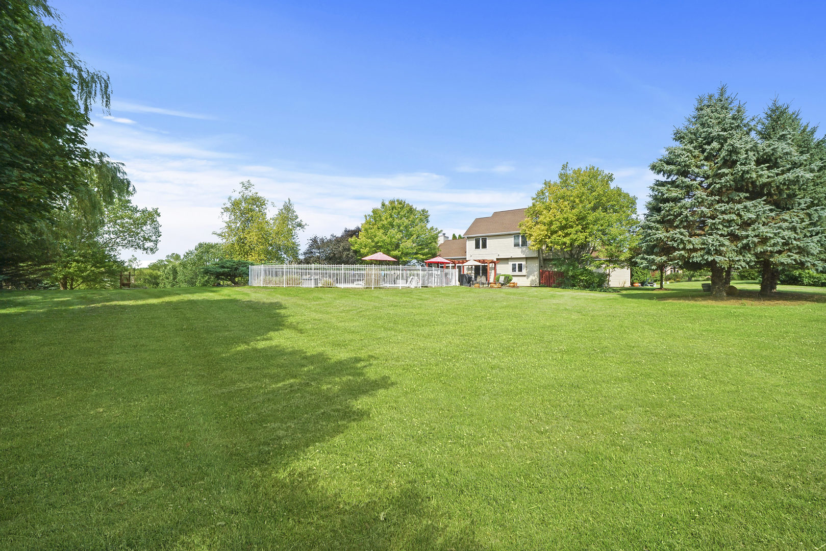 10808 Michigan Drive Spring Grove, IL 60081 - Photo 7 of 26 a view of a garden with a building in the background