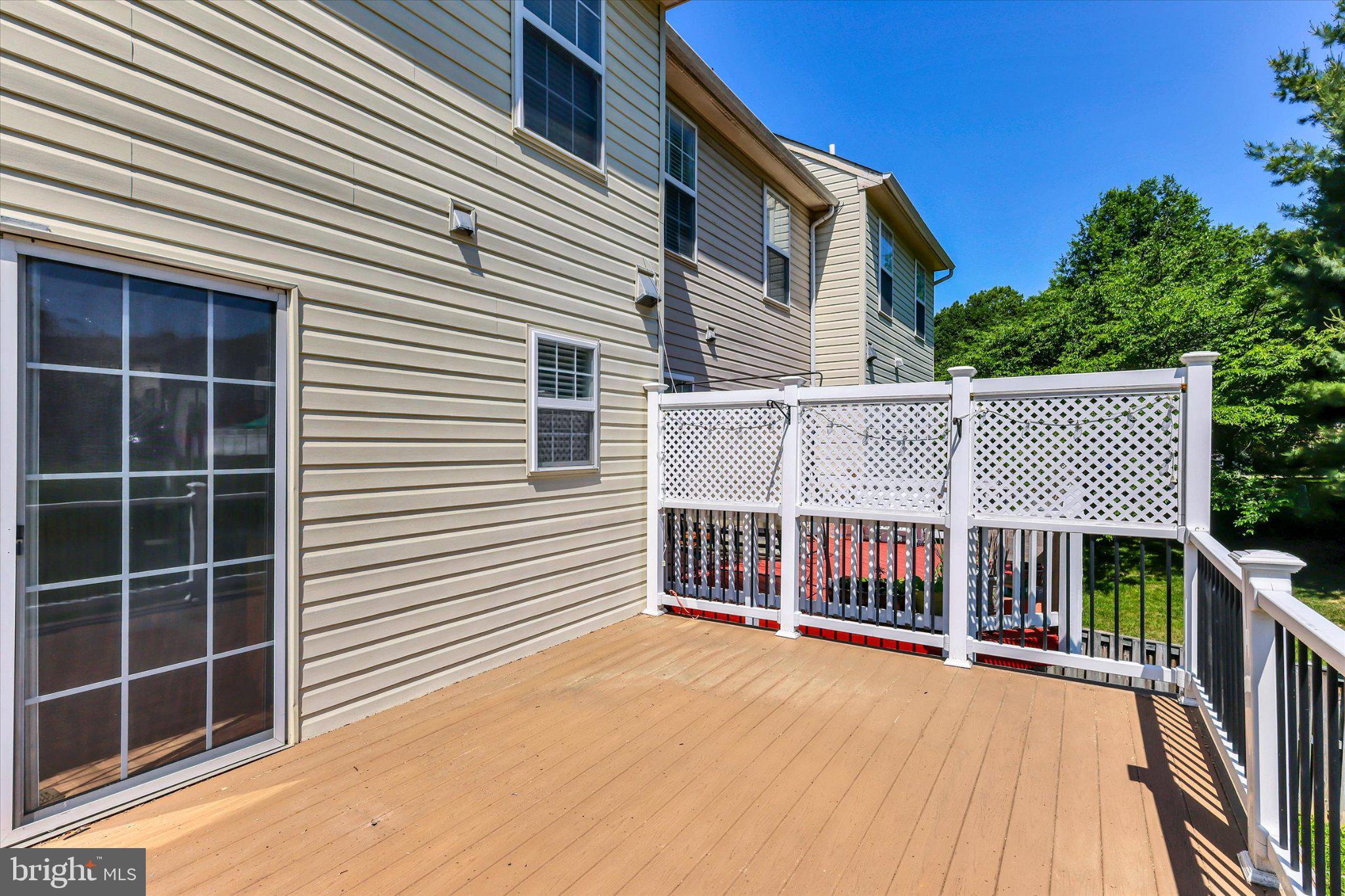 14323 Gate Dancer Lane Boyds, MD 20841 - Photo 16 of 54 Sunny deck with serene backyard views.