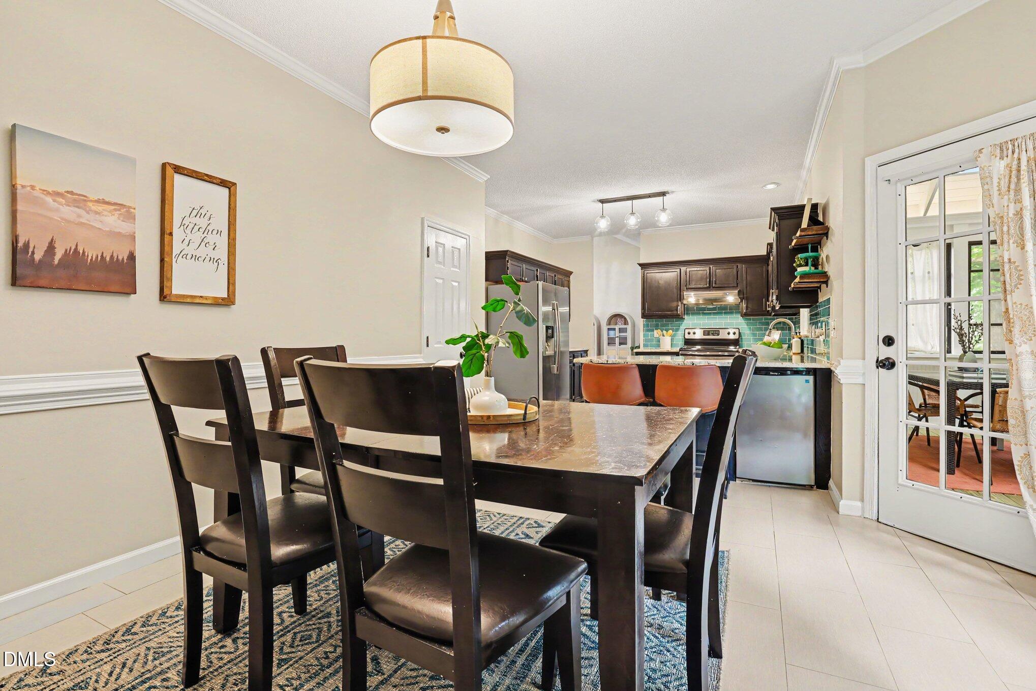 5468 Ingate Way Raleigh, NC 27613 - Photo 9 of 24 a view of a dining room with furniture