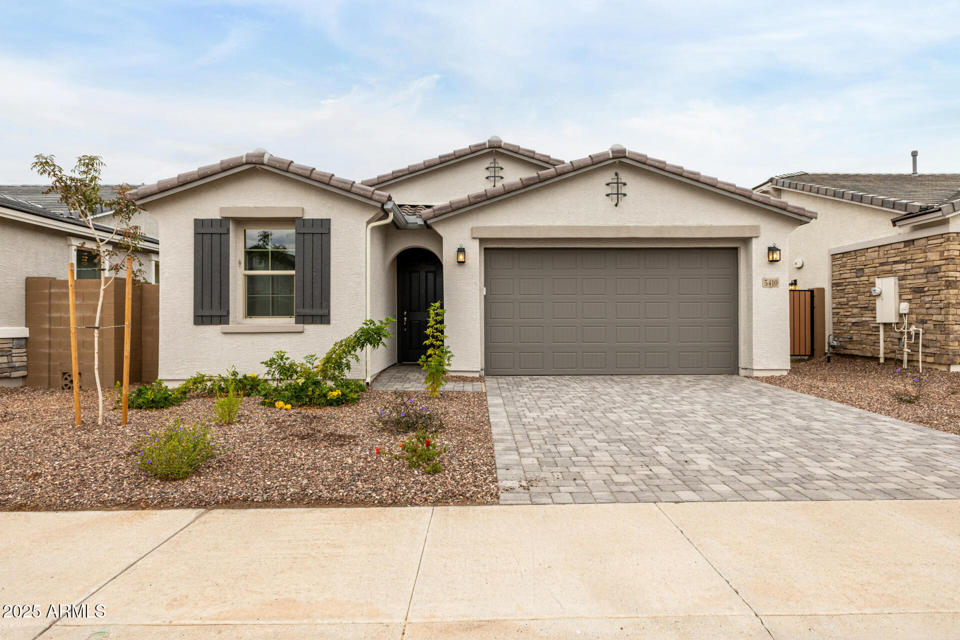 a view of a white house with a outdoor space