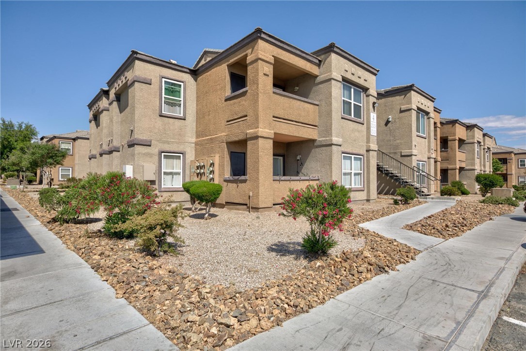 6650 West Warm Springs Road, Unit 2027 Las Vegas, NV 89118 - Photo 3 of 29 This modern building features attractive balconies and well-maintained desert landscaping.