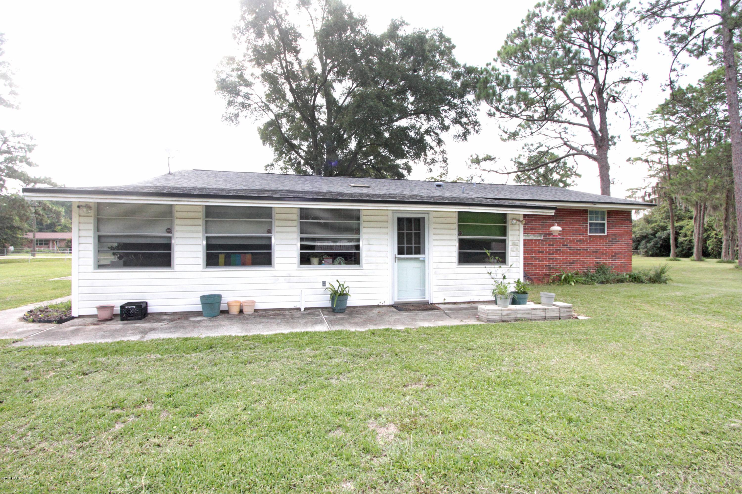 Back of the home with a finished porch