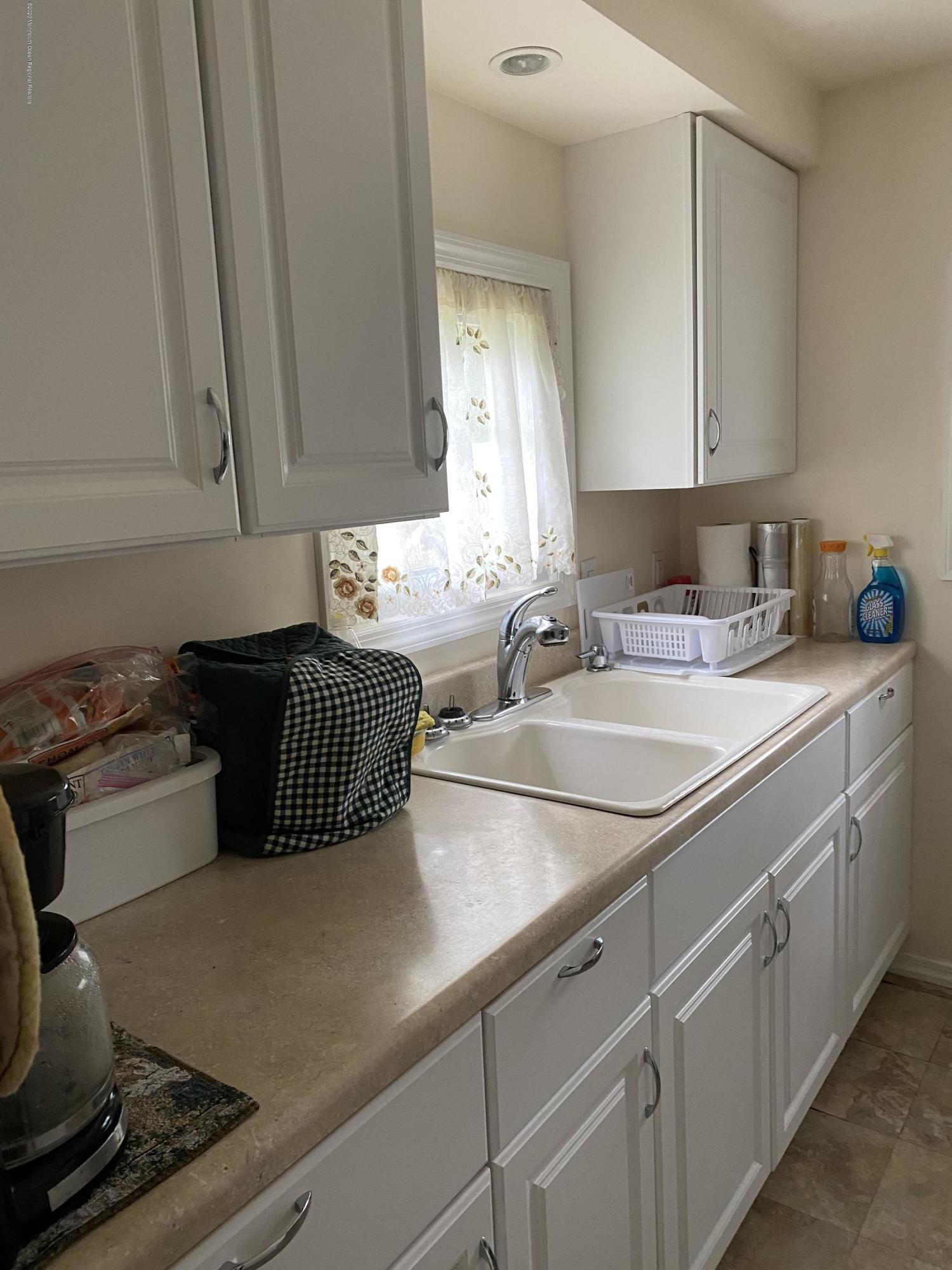 504 Roberts Road Toms River, NJ 08755 - Photo 11 of 34 a kitchen with a sink and cabinets