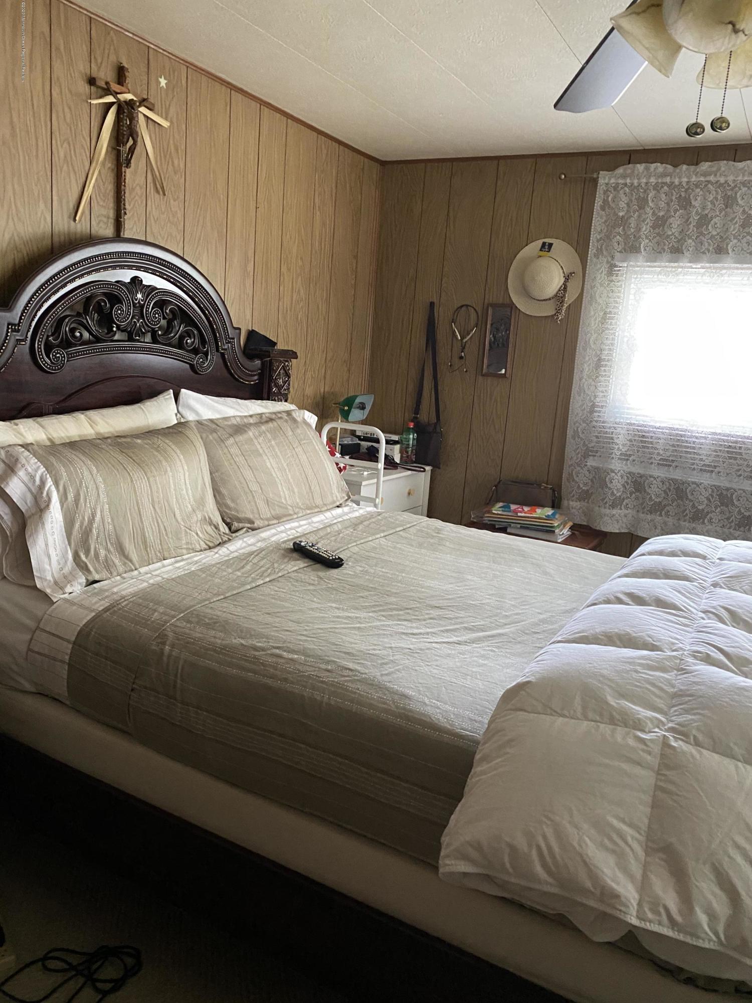 504 Roberts Road Toms River, NJ 08755 - Photo 20 of 34 a bedroom with a bed and a mirror