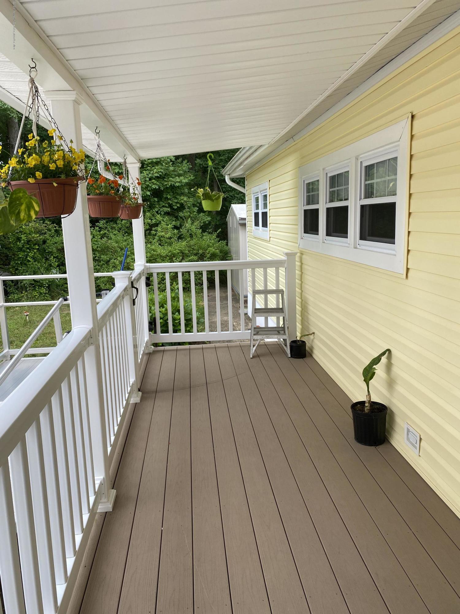 504 Roberts Road Toms River, NJ 08755 - Photo 2 of 34 a view of two chairs on the roof deck