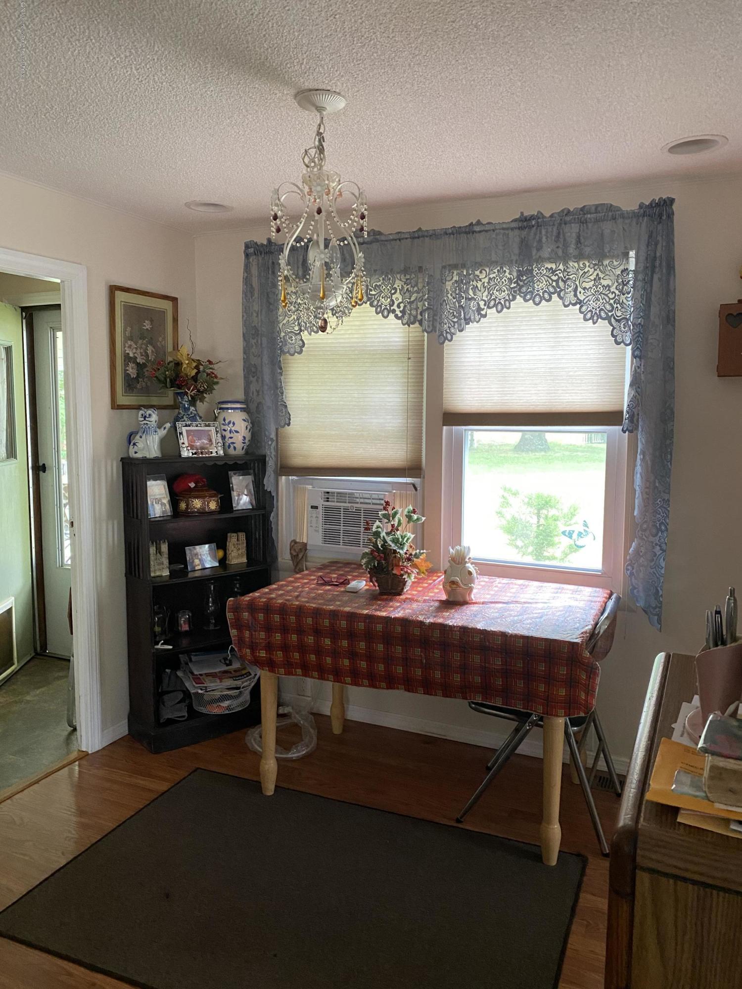 504 Roberts Road Toms River, NJ 08755 - Photo 8 of 34 a room with a table chairs and a chandelier