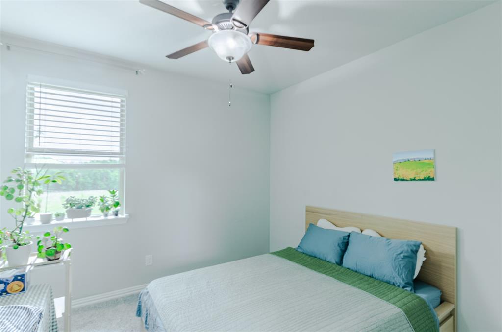 1448 Pebble Way Allen, TX 75013 - Photo 15 of 25 a bedroom with a bed and a window