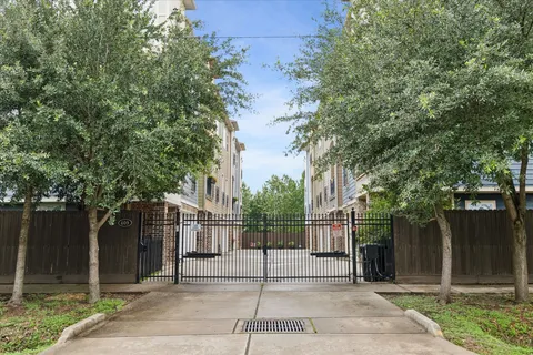 a view of a house with a fence