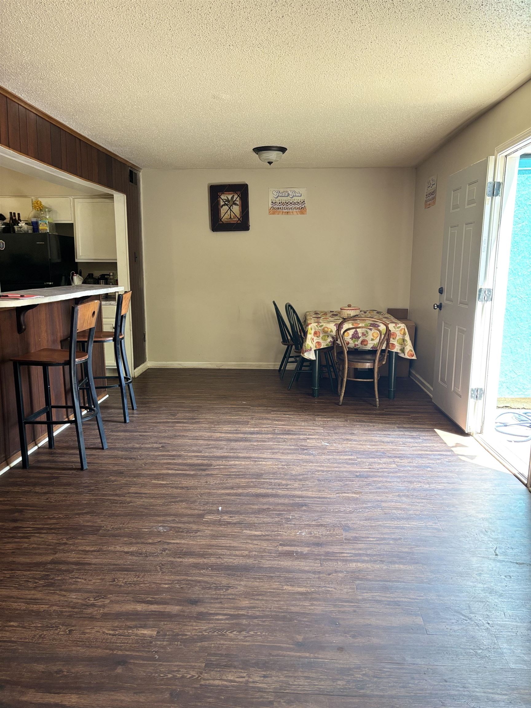 3626 Outland Road, Unit 86 Memphis, TN 38118 - Photo 3 of 24 Dining space with a textured ceiling, dark wood-style flooring, and baseboards