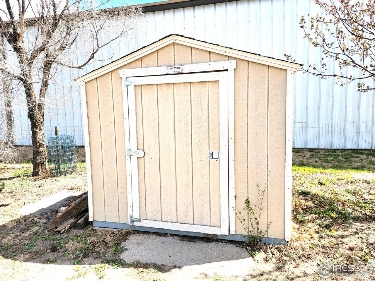 528 Phelps Street Sterling, CO 80751 - Photo 11 of 12 a view of a house with backyard and garden