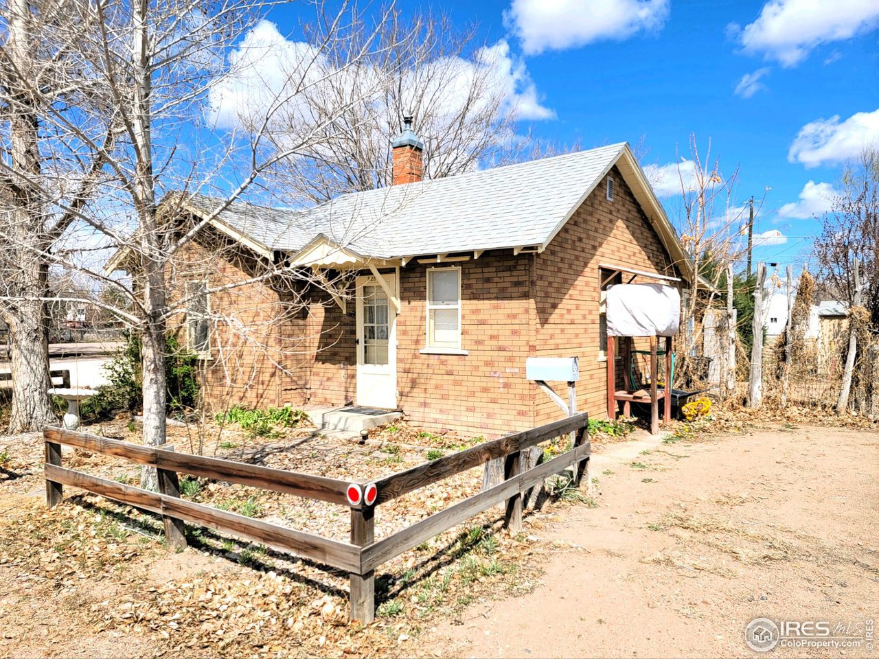 528 Phelps Street Sterling, CO 80751 - Photo 2 of 12 a view of house with a snow on the road