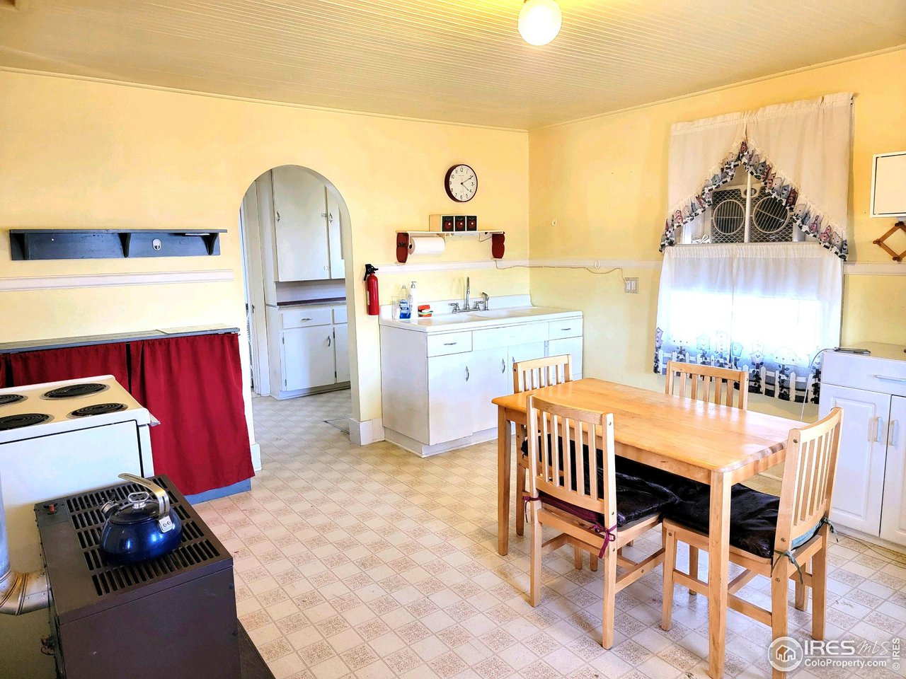 528 Phelps Street Sterling, CO 80751 - Photo 5 of 12 a dining room with furniture and window