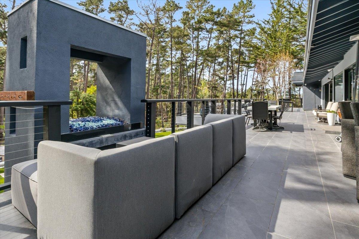 1276 Viscaino Road Pebble Beach, CA 93953 - Photo 36 of 64 a roof deck with couches and wooden fence