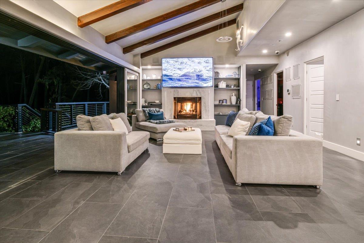 1276 Viscaino Road Pebble Beach, CA 93953 - Photo 41 of 64 a living room with furniture and a fireplace