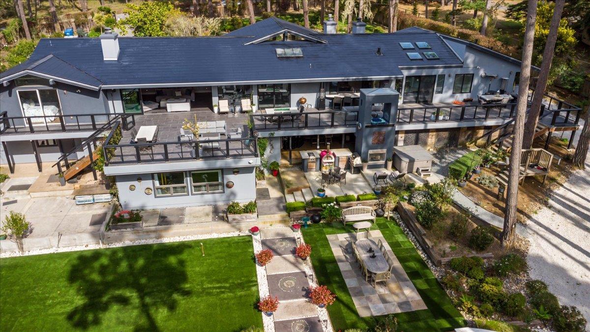 1276 Viscaino Road Pebble Beach, CA 93953 - Photo 42 of 64 a view of multiple houses with a yard
