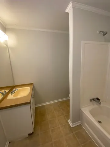 a bathroom with a sink toilet and bathtub