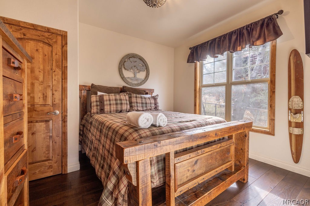 1629 Angels Camp Road Big Bear City, CA 92314 - Photo 19 of 40 a bed sitting in a bedroom next to a window