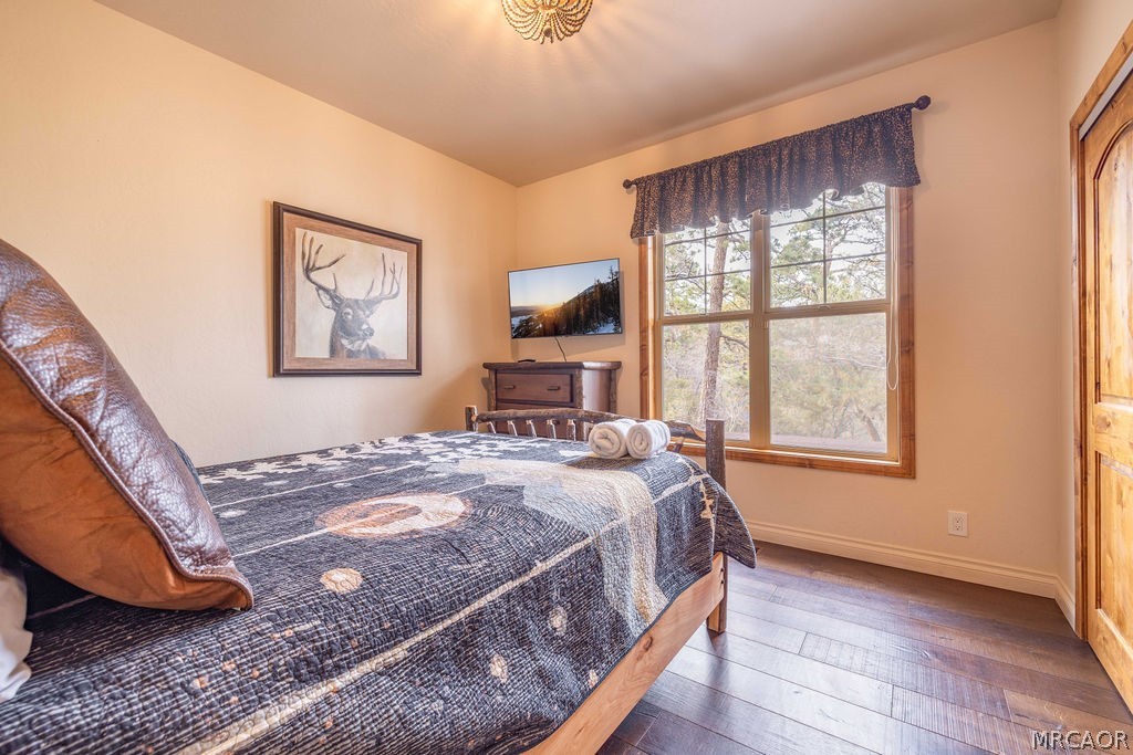 1629 Angels Camp Road Big Bear City, CA 92314 - Photo 21 of 40 a bedroom with a bed and a window