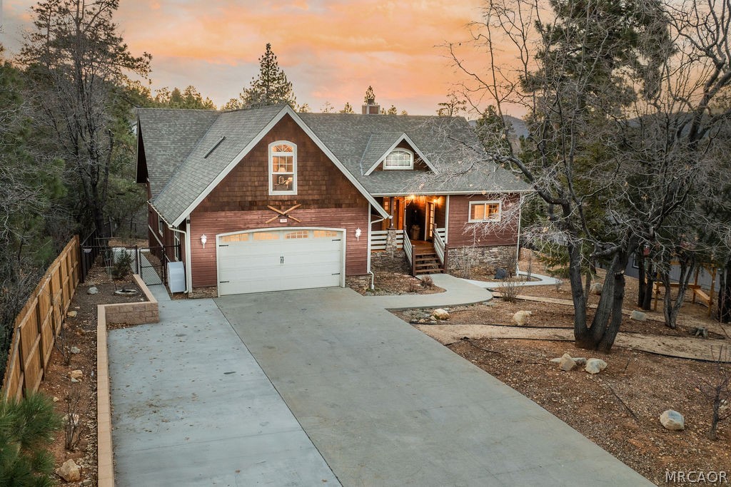 1629 Angels Camp Road Big Bear City, CA 92314 - Photo 3 of 40 a front view of a house with a yard and garage