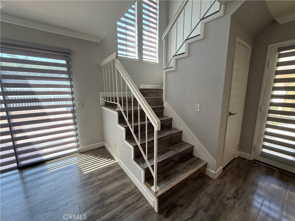 2201 Cheyenne Way, Unit 125 Fullerton, CA 92833 - Photo 18 of 30 a view of entryway with wooden floor and stairs