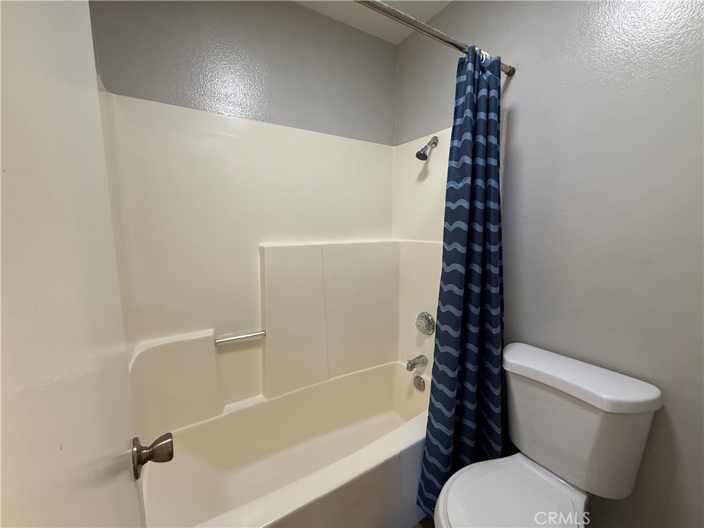 2201 Cheyenne Way, Unit 125 Fullerton, CA 92833 - Photo 22 of 30 a white toilet sitting next to a bath tub