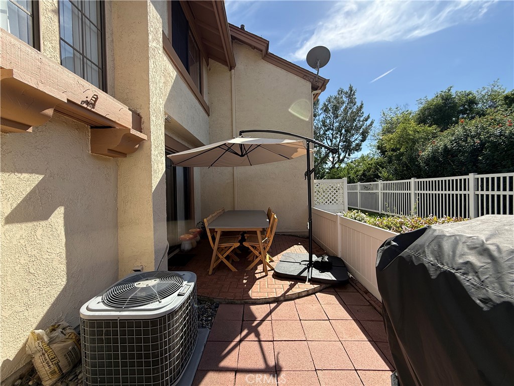 2201 Cheyenne Way, Unit 125 Fullerton, CA 92833 - Photo 28 of 30 a view of a patio with chair and potted plant