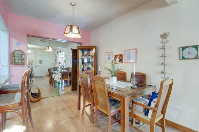 a dining room with furniture and window