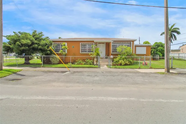 a view of swimming pool with a yard and sitting area