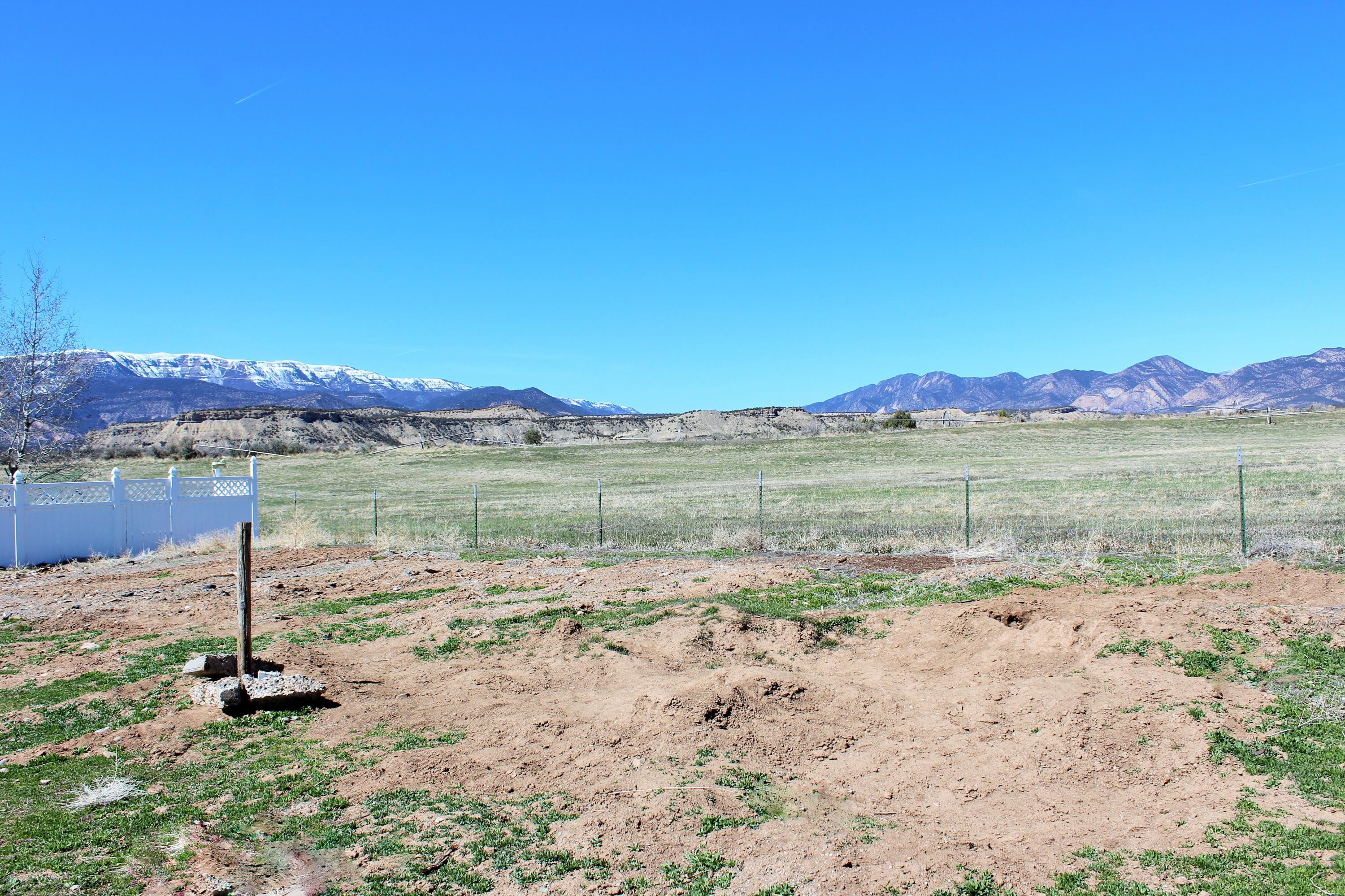 818 East 19th Street Rifle, CO 81650 - Photo 3 of 5 a view of lake with mountain