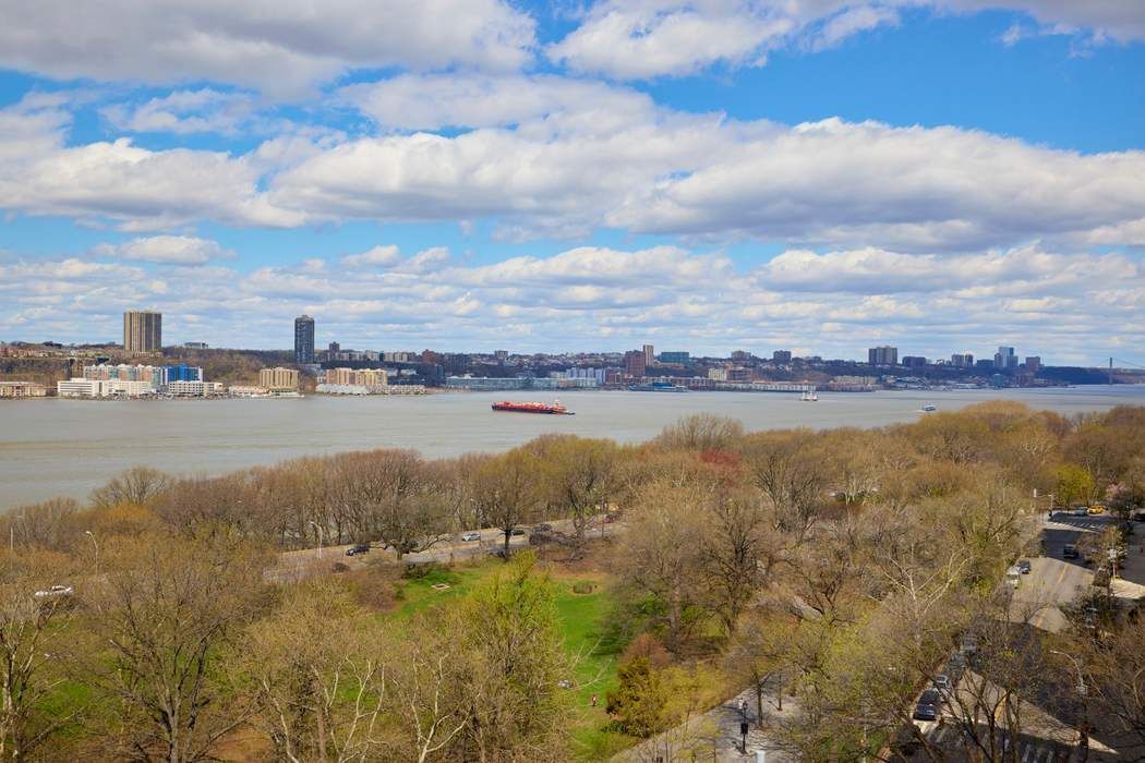 5 Riverside Drive, Unit 12C Manhattan, NY 10023 - Photo 2 of 12 a view of a lake with houses in the back