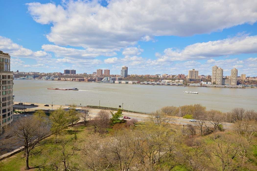 5 Riverside Drive, Unit 12C Manhattan, NY 10023 - Photo 3 of 12 a view of a lake with a city in the background