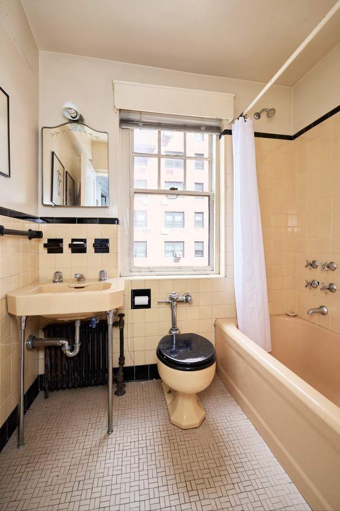 5 Riverside Drive, Unit 12C Manhattan, NY 10023 - Photo 10 of 12 a bathroom with a sink toilet a mirror and bathtub